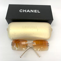 Chanel Rhinestone Orange Tinted Gold CC Logo Rimless Sunglasses